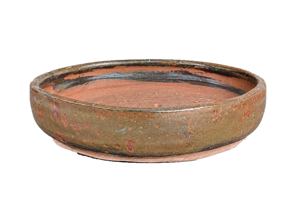 Bronze and copper shallow round pot with a low profile, copper-red glaze flecks and clay foot ring