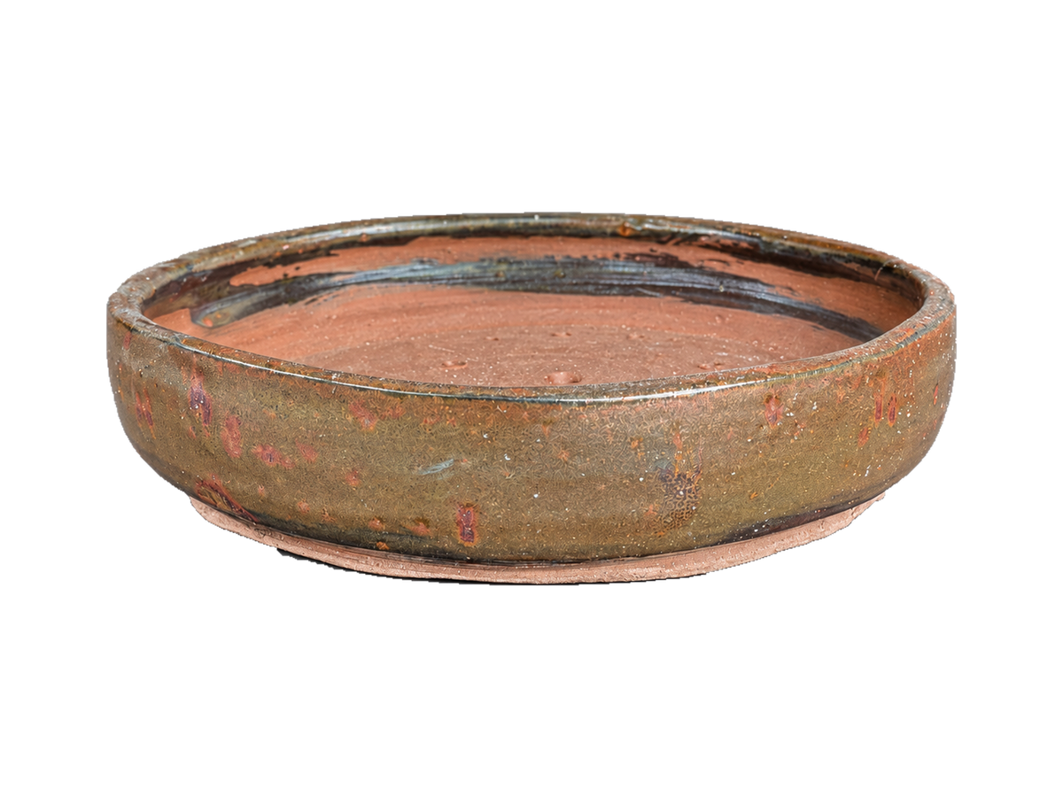 Bronze and copper shallow round pot with a low profile, copper-red glaze flecks and clay foot ring