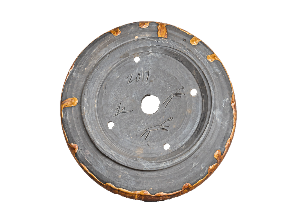 Underside of the amber and charcoal pot showing the 2017 date, incised maker marks and foot ring