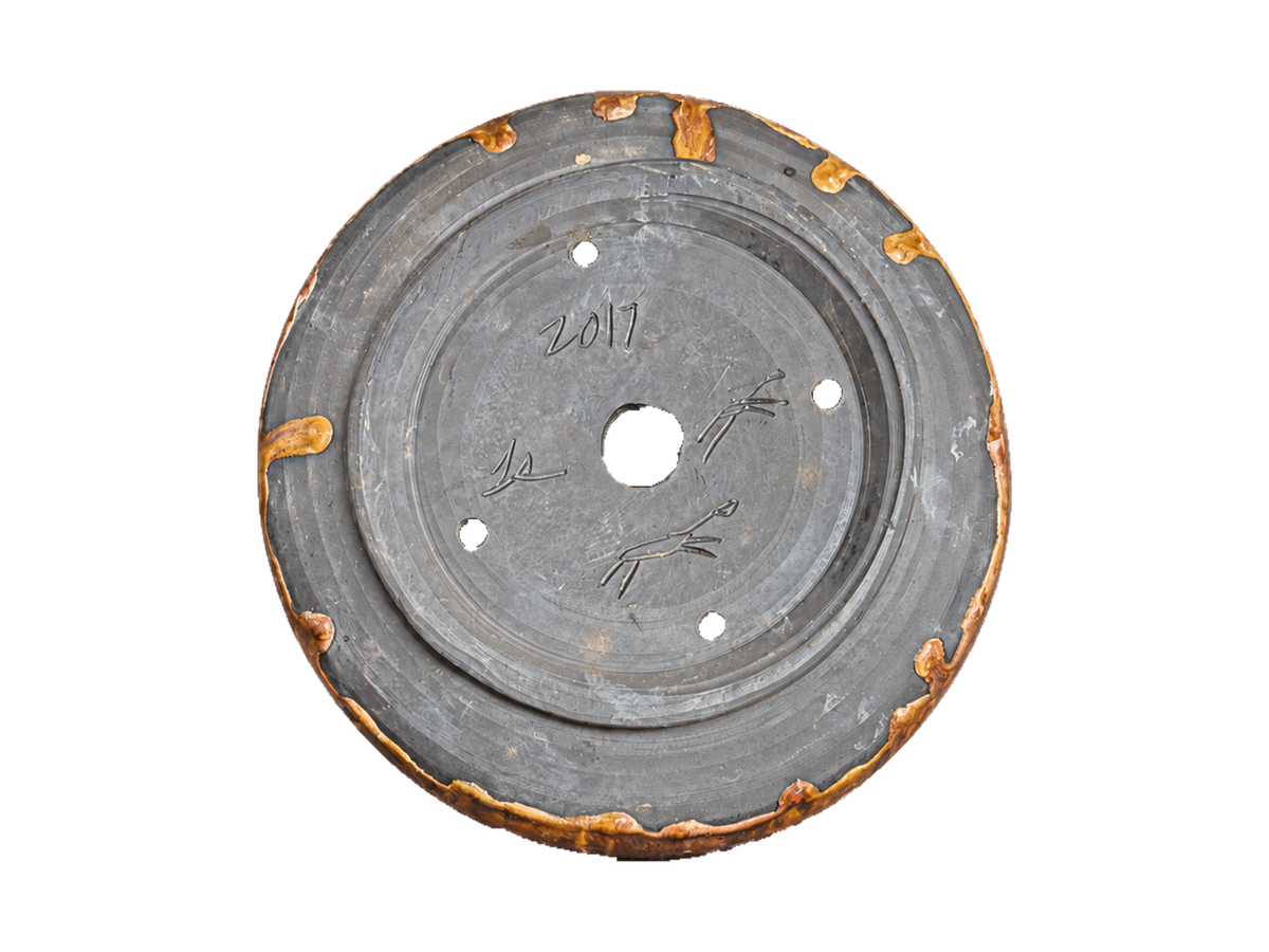 Underside of the amber and charcoal pot showing the 2017 date, incised maker marks and foot ring